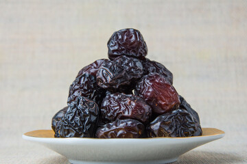 Delicious ajwa dates ( kurma nabi ), Much sought after during the month of Ramadan as a dish for breaking the fast, ramadhan kareem, empty space, copy space.