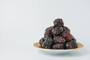 Delicious ajwa dates ( kurma nabi ), Much sought after during the month of Ramadan as a dish for breaking the fast, ramadhan kareem, empty space, copy space.