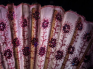 Spanish pink hand fan full of details