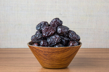 Delicious ajwa dates ( kurma nabi ), Much sought after during the month of Ramadan as a dish for breaking the fast, ramadhan kareem, empty space, copy space.