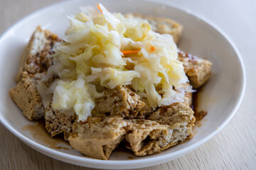 Famous Taiwanese snack of stinky tofu on the table