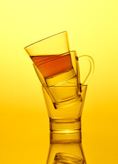 Empty and half full double glass tea cups standing like a pyramid