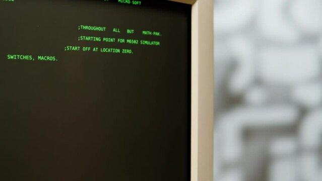 Retro pc with loading code console, programmer making scripts, green basic screen, Old computer studio close-up, Desktop vintage retro wave display, late 90s PC.