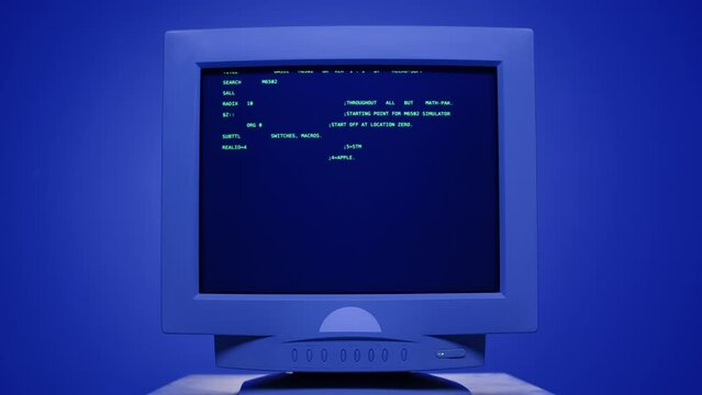 Retro pc with loading code console, programmer making scripts, green basic screen, Old computer studio blue night background close-up, Desktop vintage retro wave display, late 90s PC.