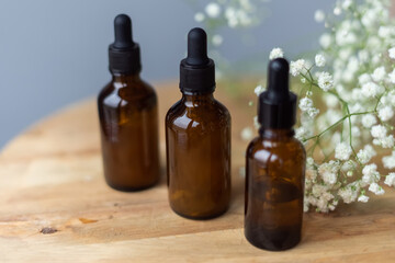 Fototapeta na wymiar Cosmetic bottles for oil. Phermaceutical organic spray for massage and spa procedures