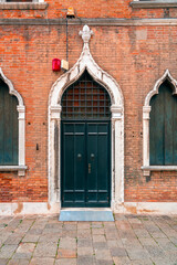 Typical venetian style door and windows in Venice, Italy