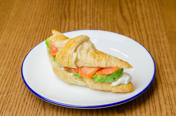 Croissant with red fish and avocado