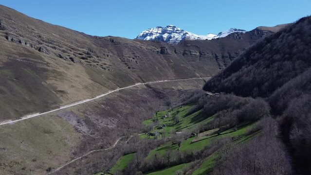 4K drone video in a valley with snow mountains in valles pasiegos