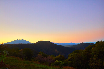 mountains at sunset with yellow color in the horizont and cold tones in the sky, santa maria del oro nayarit 