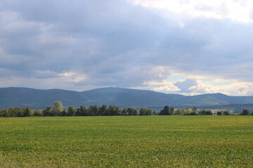 Brocken Mountain and agricultural field seen close from Vienenburg, northern Harz Mountains