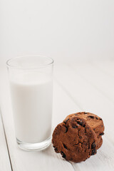 Glass of milk and chocolate biscuits for breakfast