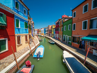 Fototapeta na wymiar Burano village with colorful house architecture with pure summer feeling 