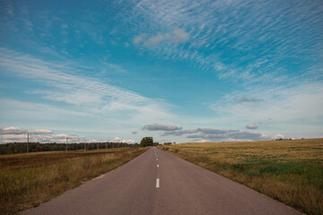 the road leading to garizont on the background of a beautiful sky