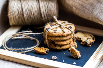 Close-up view of freshly baked chocolate chip cookies with twine