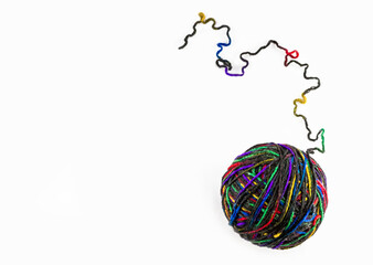 Top view of colorful yarn ball with woolen thread on white background
