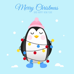 Cute penguin in a pink hat and wrapped in a Christmas garland