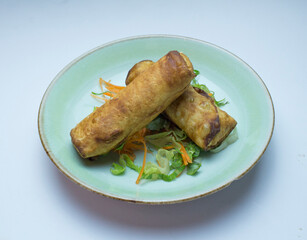 Egg rolls are a variety of deep-fried appetizers served in American Chinese restaurants. An egg roll is a cylindrical, savory roll with shredded cabbage, chopped meat, or other fillings inside a thick