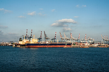 Cargo ship and cranes in the port