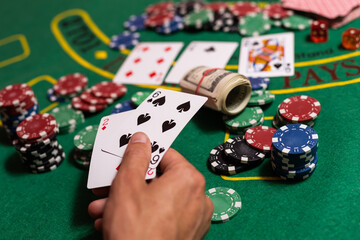 man playing blackjack at the table and betting chips