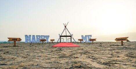 Valentina's day romantic marry me marriage proposal idea at beach sand