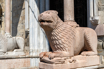 Two great marble lions guarding the entrance Portal of the Parma Cathedral (Santa Maria Assunta) in Italy