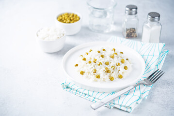 Onion green peas rice in a plate