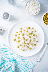 Onion green peas rice in a plate