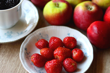 Various healthy seasonal food arranged on wooden background. Selective focus.