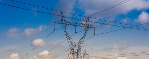 Fototapeta premium Powerline against a blue sky