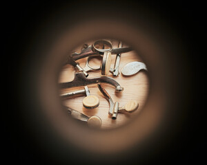 Various old clarinet keys and pads are seen through the aperture of a clarinet bell