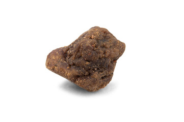 A small piece of the mineral spinel. Brown stone with a porous surface