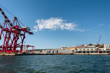 Fototapeta na wymiar View from a tour boat passing by the Port of Lisbon