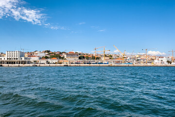 Fototapeta na wymiar View from a tour boat passing by the Port of Lisbon