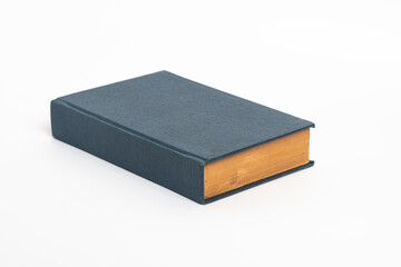 Old blue book isolated on a white background , Old vintage book with a blue cover 