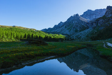 Naklejka na ściany i meble The mountains of the natural park alpe veglia - alpe devero during a sunny day, near the town of Baceno, Italy - July 2022.
