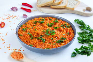 Red lentil dish with tomatoes and peppers. Vegetarian cooking