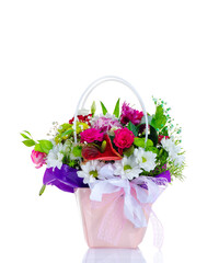 Bouquet of flowers in a basket on a white background