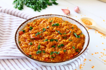 Red lentil dish with tomatoes and peppers. Vegetarian cooking