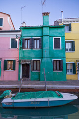 Fototapeta na wymiar View on colorful Burano's lagoon in a winter day during sunset. Burano, Venice, Italy