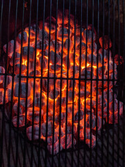 Red Hot Charcoal Coals burning with flames inside Grill