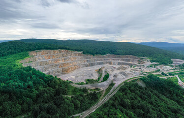 Stone Quarry in Croatia, Europe. Aerial View of Opencast Mining Quarry With Lots of Machinery. View from Above. Marble Mining Industry