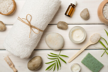 Composition with spa products on wooden background, top view
