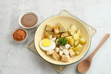 Batagor, Indonesian food made from fried fish dumpling, tofu, egg and potatoes with peanut sauce. 
