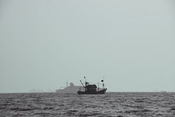A distant boat in the sea