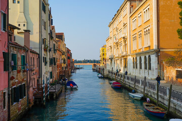 A canal heading out to sea in Venice, Italy
