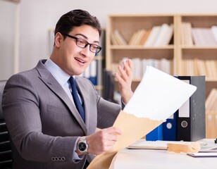 Businessman receiving letter in the office