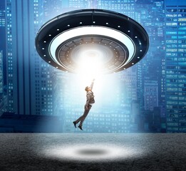 Flying saucer abducting young businessman