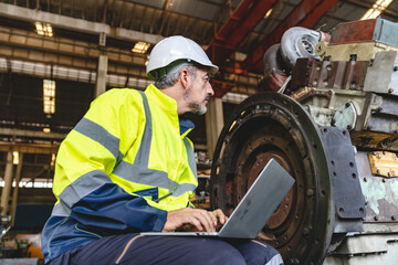 professional technician engineer with safety helmet hard hat working in industrial manufacturing factory, men at work to checking equipment of machinery production technology or construction operating