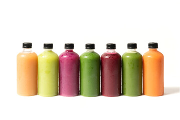 Set of organic cold pressed juice in bottles on white background