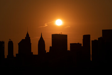 Fototapeta na wymiar Lower Manhattan skyline silhouette sunset 